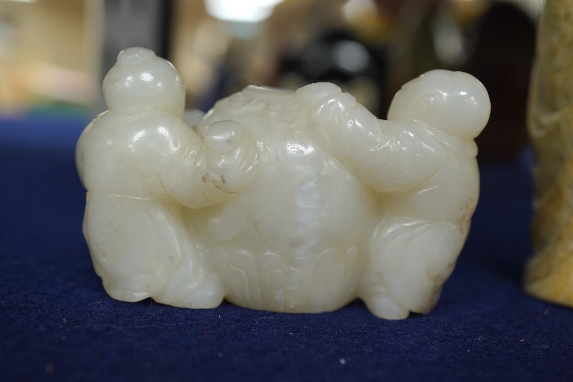 A Chinese white jade 'boys with jar' carving and three shoushan stone figures; luohan, girl with squirrel and mermaid (4), tallest 11cm